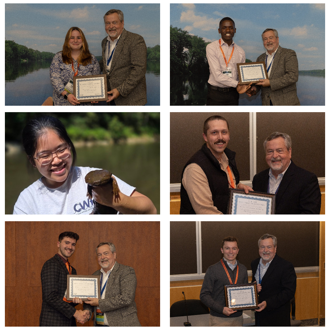 People standing around an academic poster, one presenting and several listening.